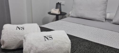 a bed with two white pillows on top of it at NS Bolaños in Bolaños de Calatrava
