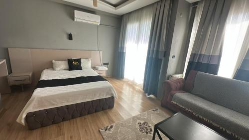 Ένα ή περισσότερα κρεβάτια σε δωμάτιο στο Ada Residence Buca