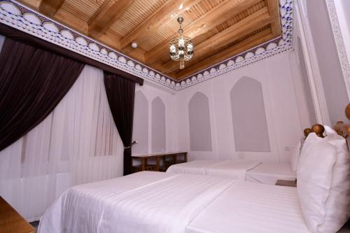 Ένα ή περισσότερα κρεβάτια σε δωμάτιο στο SARROJ Boutique