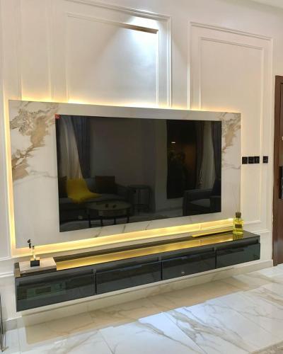 a large mirror on a wall in a living room at Second Home in Lekki