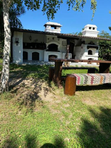 a house with a picnic table in front of it at Casa Vadim in Turda