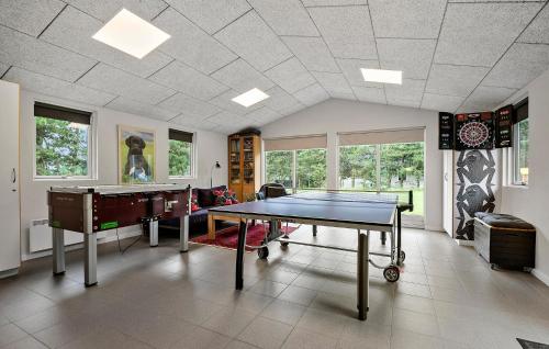 a living room with a ping pong table in it at Lovely Home In Ansager With Wifi in Ansager