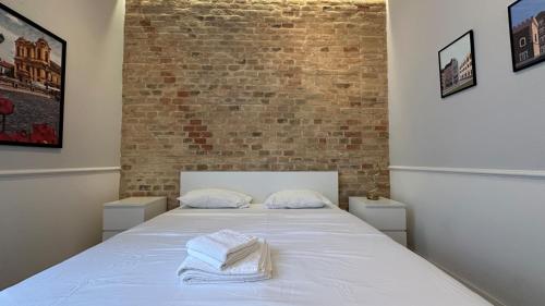 Katil atau katil-katil dalam bilik di Carol Residence - ultra central - powered by NEO