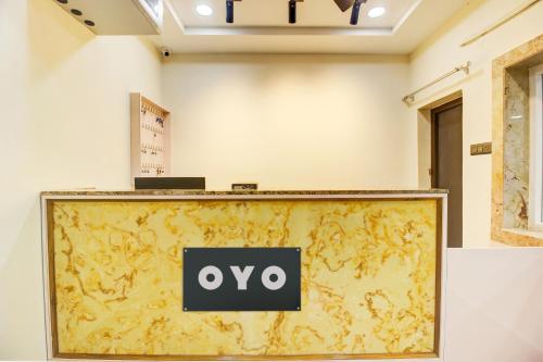 a large screen with the oo sign on a wall at Super Hotel O EMBASSYINN in Kondapur