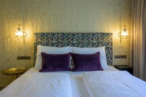 Hotel Jägerhof Mayrhofenにあるベッド