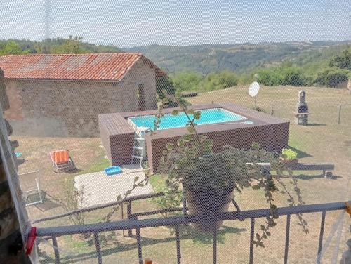 a view of a backyard with a swimming pool at Locazione turistica La Bella Langa in Castellino Tanaro