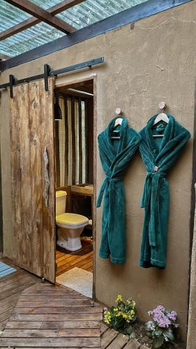 an open door to a bathroom with a toilet at Vila Abaton in Alto Paraíso de Goiás