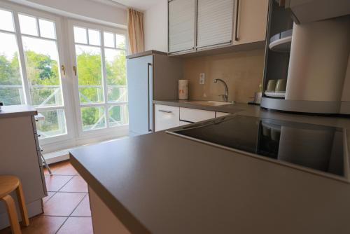 a kitchen with a large black counter top at Seezeit-Residenz in Bad Saarow