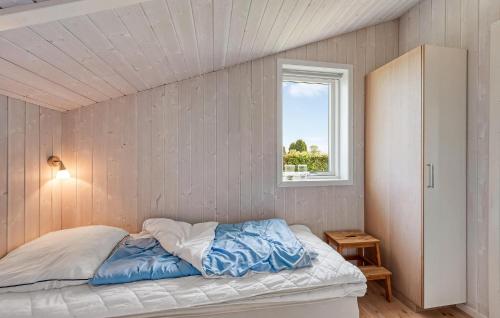 a bed in a room with a window at Holiday Home Chr Jacobsensvej in Årøsund