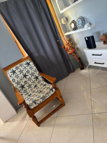 a chair with a pillow on it in a room at Desired View in Choiseul