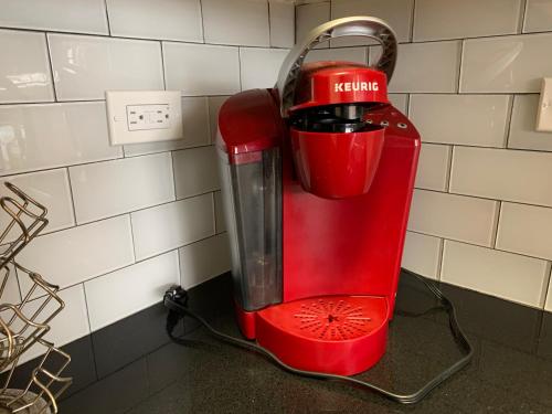 a red blender sitting on top of a counter at Creole Nest 2 in New Orleans
