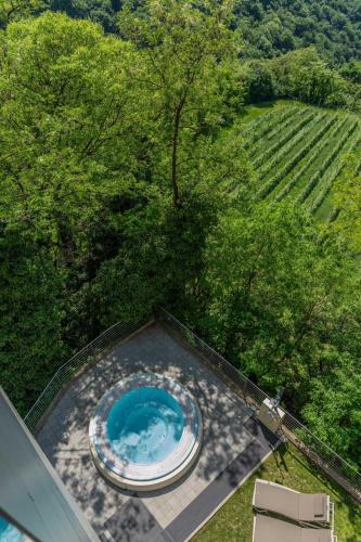 an overhead view of a swimming pool on top of a house at Hotel Villa Madruzzo in Trento