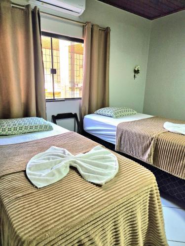 En eller flere senge i et værelse på Casa para Eventos e Festas de fim de Ano