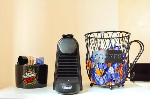 a basket of candy is next to a blender at Bellavista Holiday Home in Pescara