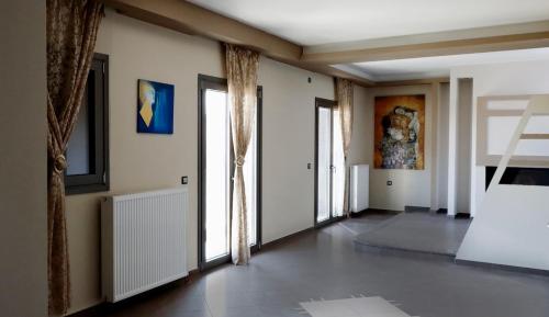 Μια τηλεόραση ή/και κέντρο ψυχαγωγίας στο Avra home by Memento Vivere Luxury Properties