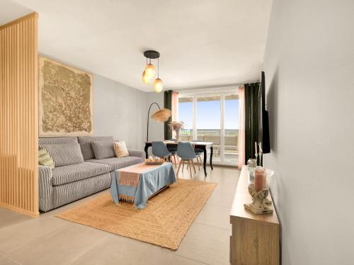 a living room with a couch and a table at Nouveau T3 Mira Lattes Proche Montpellier et Plages in Lattes