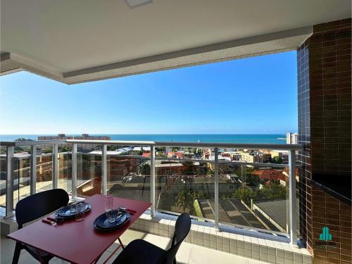 a balcony with a table and a view of the ocean at Aquarius Style by Holiday Stays in Fortaleza
