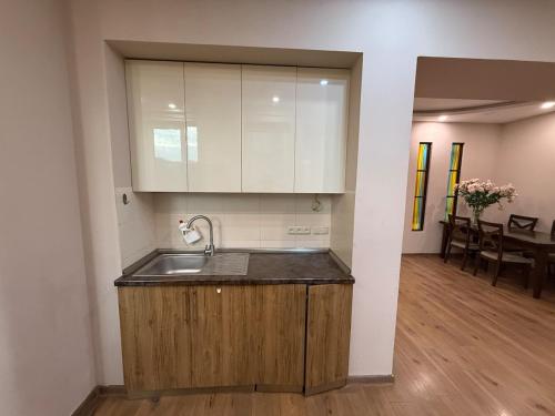 a kitchen with a sink and a counter top at Family Comfort Apartment on Mashtots 3 in Aghk'ilisa