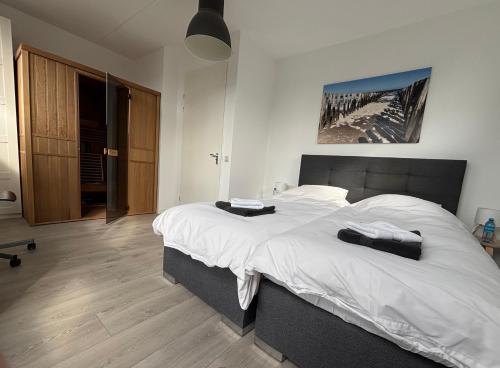 Ένα ή περισσότερα κρεβάτια σε δωμάτιο στο Wellness Villa Binnenhof