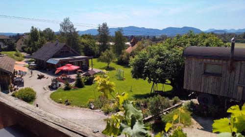 an aerial view of a garden with a resort at Bio Archehof Zachhiesen - stay & relax in Seekirchen am Wallersee