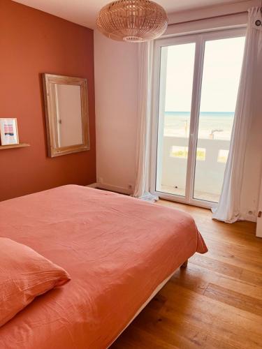 Katil atau katil-katil dalam bilik di Villa Face mer Les Goélands