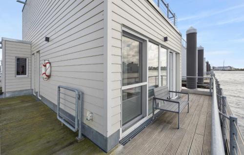 a house with a large window on the side of it at Seebär in Olpenitz