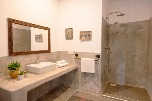 a bathroom with a sink and a shower at Matemwe House 1 in Matemwe