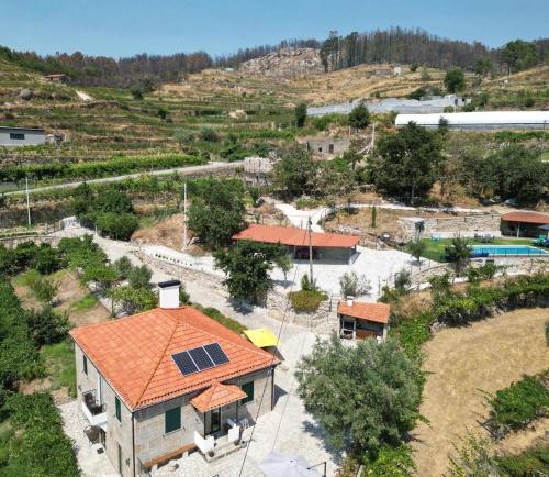 an overhead view of a house with an orange roof at Quintinha de Pinouco in Resende