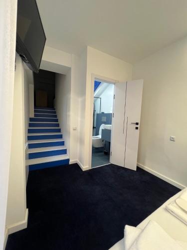 a room with a staircase leading to a bedroom at Hotel Tigran Mets Yerevan in Yerevan