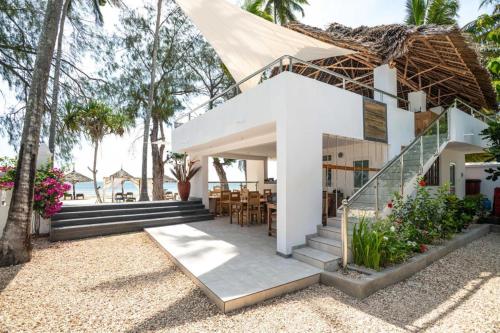 a villa with a view of the ocean at Seashore Eco Bungalow front ocean in Kumba Urembo