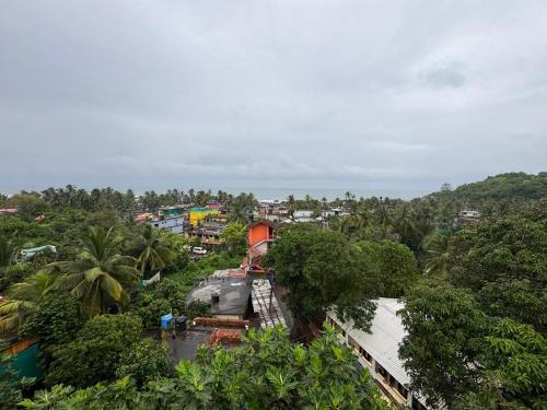 an overhead view of a city with trees and buildings at Hippy Trail Guest House and Dorms in Arambol