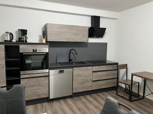 a kitchen with a sink and a stove top oven at HausOase Zimmervermietung Gergert in Schwäbisch Hall