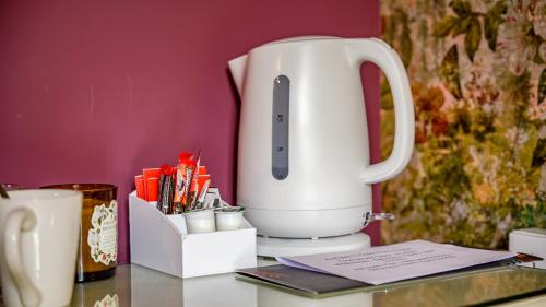 a white mixer sitting on top of a counter at The Shoulder of Mutton in Calverton