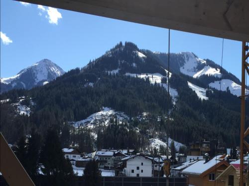 a view of a snowy mountain from a window at Apartment in Brixen near Ski Lift in Feuring