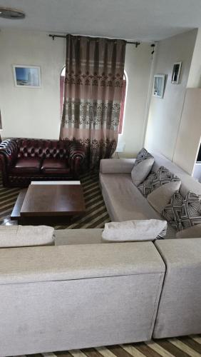 a living room with two couches and a couch at Cool Nest Floreal in Curepipe Road Station