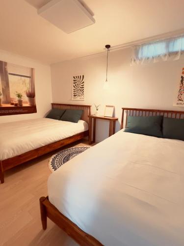 a bedroom with two beds and a window at Sun Gangnam Stay in Seoul