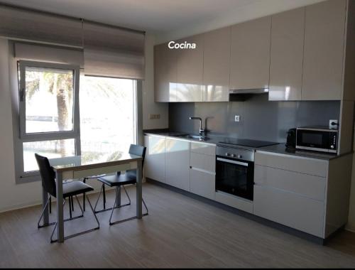 Kuchyň nebo kuchyňský kout v ubytování Vistas al mar en Corrubedo