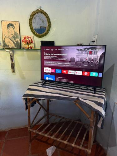 a laptop computer sitting on a stand on a table at Mirante 180 - Praia de Barreiras in Icapuí
