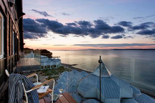 a view of the water from the balcony of a house at Marienlyst Strandhotel in Helsingør