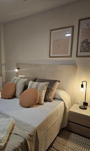 a bedroom with two beds with pillows on it at Chez Marie in La Muela