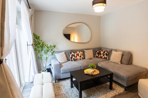 a living room with a couch and a table at Birmingham Central Cosy 4BR Home with Free Parking in Birmingham