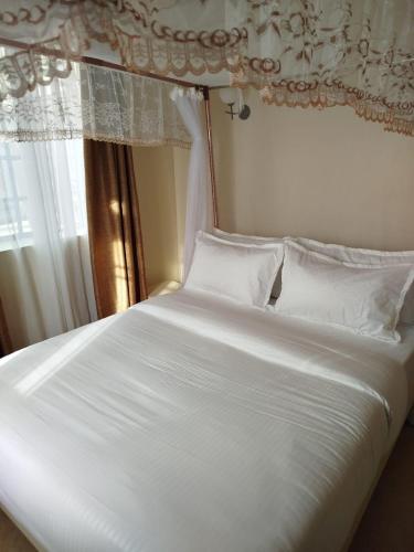 Postel nebo postele na pokoji v ubytování Lakeview Apartments - Victoria