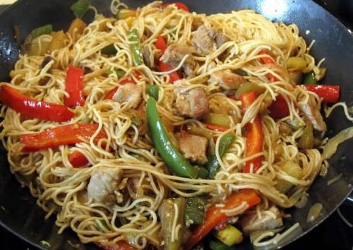 a bowl of noodles with meat and vegetables at Little Ranch Hotel Spa Pilar in Manuel Alberti