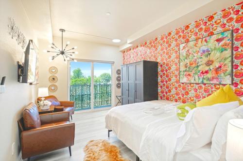 a bedroom with a large bed and a large window at I- Lovely Family Home Near Universal with Patio and Games in Sepulveda