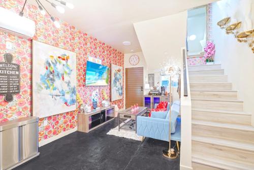a room with a staircase and colorful walls at I- Lovely Family Home Near Universal with Patio and Games in Sepulveda