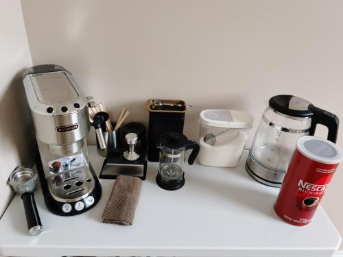 a counter with a coffee maker and other kitchen items at Full Kitchen AC Share Bathroom #2 in Halifax
