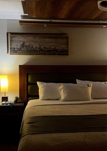 En eller flere senge i et værelse på Hotel El Marqués