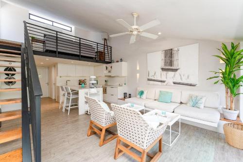 a living room with a white couch and chairs at 3013 - Mixie 305 in Santa Cruz Huatulco