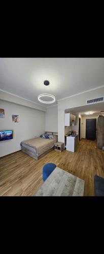 a room with a bed and a table in it at Alvina complex in Tsaghkadzor