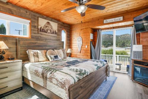 a bedroom with a bed and a ceiling fan at Jay bird landing escape #2308 in Big Bear City